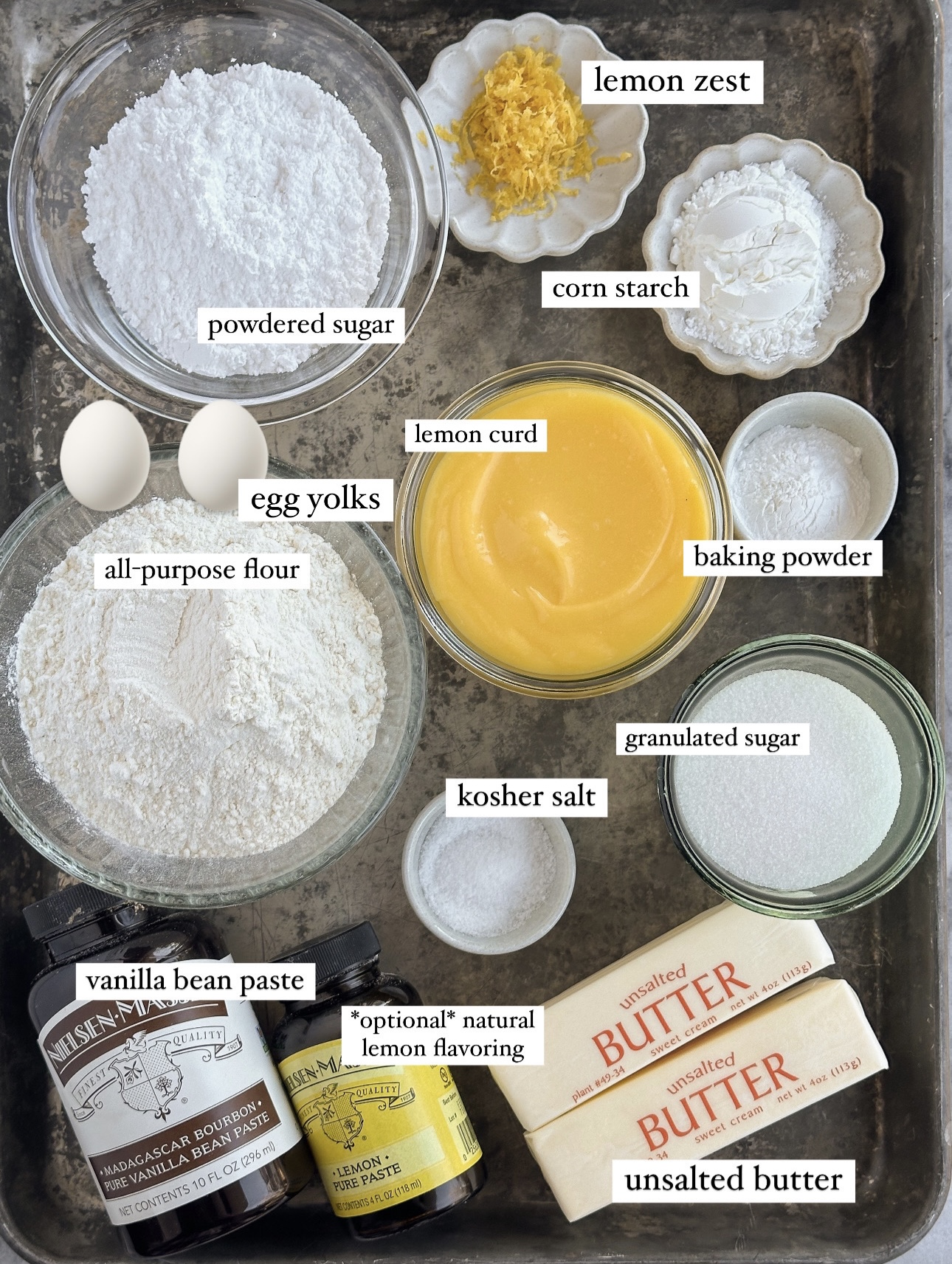 ingredients for lemon bar cookies gathered on a baking tray